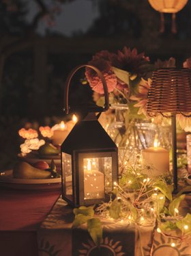 Glowing Al Fresco Spring Dining with Black Lantern, TruGlow® Candles and Fairy Lights