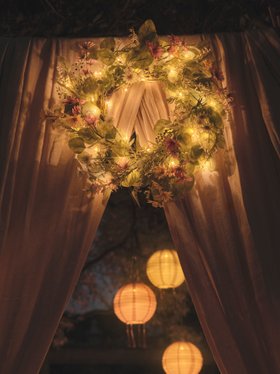 Ambient Spring Summer Evening Garden Lighting with Glowing Wreath & Paper Tassel Lanterns