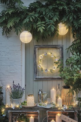 Glowing Spring Garden Side Table with TruGlow® Outdoor Candles, Paper Lanterns & Light Up Flower Wreath