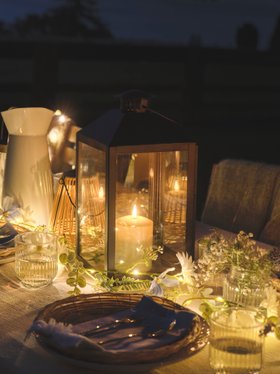 Glowing Spring Summer Dining Table Place Setting with Black Lantern and TruGlow® Candles & Flower Garland