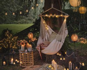 Glowing Summer Garden Reading Nook with TruGlow® Outdoor Candles, Fairy Lights and Lanterns