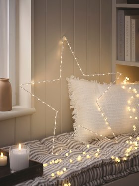 Cosy Corner with glowing Osby Star Window Light, Pearl Micro LED Battery Cluster Lights & TruGlow® LED candles