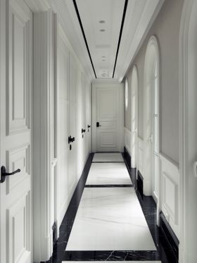 An Eccentric Classic Sanctuary | white paint hallway with marble flooring
