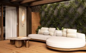 Outdoors | outdoor garden area with Godard cosy white sofa, Philip brown center table, Coltrane wall lamp, cushion, and wood flooring