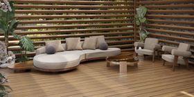Outdoors | outdoor garden area with Godard cosy white sofa, Caprice glass center table, Ghibli armchair, vase, cushion, and brown wood flooring