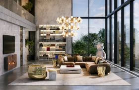 Open Space | spring/summer living room in modern classic style with Opus cosy brown modular sofa, Quarry white marble center table, Hera gold suspension lamp, Imperfectio luxury armchair, Coleccionista bookcase for storage, Sistine rug, and fireplace
