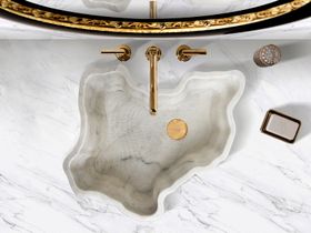 Bathroom | marble bathroom decor in gold details with Eden curvy stone vessel sink