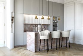 Kitchen | marble kitchen island with Besame curvy white bar stool, Gia gold pendant lamp, Flora sconce wall lamp, cabinet for storage, and wood flooring