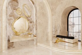 Bathroom | sculptural marble bathroom in neutral style with Lapiaz gold and dark bathtub, Halo set of wall mirrors, Lapiaz vessel sink, cabinet for storage, and bathrobe