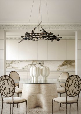 Eat in Kitchen | all white paint kitchen dine in marble finishes with Rose dark chandelier, Enchanted nature inspired dining chair, glass and stone dining table, decorative accessories, and cabinet for storage