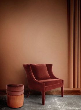 Living Room | orange paint reading corner with Athina curvy deep brown chair, Sophia cosy brown and orange stool, and cushion