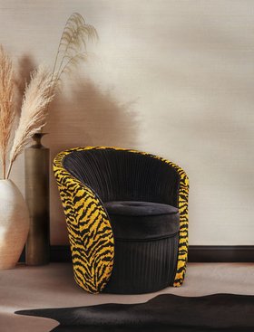 Living Room | cosy reading corner with Bloom curvy dark and yellow armchair in velvet and leopard print style