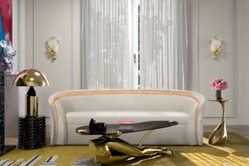 Living Room | spring/summer decor in quiet luxury style with Sultana curvy white sofa, Tabu glass center table, Valencia yellow rug, Muse sconce, gold table lamp, and curtain