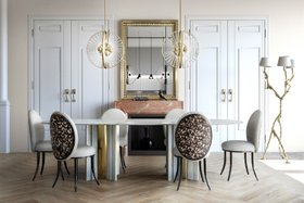 Dining Room | spring/summer dining area in art deco style with Merveille animal print dining chair, Paris white marble dining table, Roxy gold chandelier, wall mirror, exquisite floor lamp, stove, and wood flooring