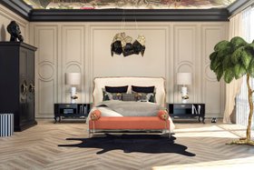 Bedroom | black and white paint bedding area in maximalist style with Forbidden bed, Privê orange daybed, Hypnotic glass gold chandelier, Vengeance table lamp, Tower dark bedside table for storage, Parisian armoire, rug, pillow, mantle, and wood flooring