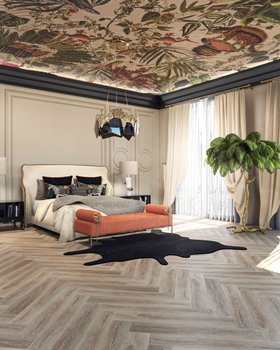 Bedroom | black and white paint bedding area in maximalist style with Forbidden bed, Privê orange daybed, Hypnotic glass and gold chandelier, Vengeance table lamp, rug, pillow, mantle, palm tree, curtain, nature-inspired wallpaper, and wood flooring