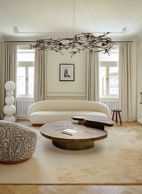 Living Room | white paint reading corner in quiet luxury style with Myth aged brass coffee table, Rose dark chandelier, cosy sofa, neutral rug, curtain, and wood flooring