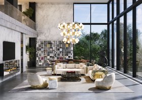 Open Space | spring/summer living room in modern classic style with Imperfectio cosy white sofa, Quarry dark marble center table, Hera gold suspension lamp, Angra curvy armchair, Coleccionista bookcase for storage, Sistine rug, and Lapiaz fireplace