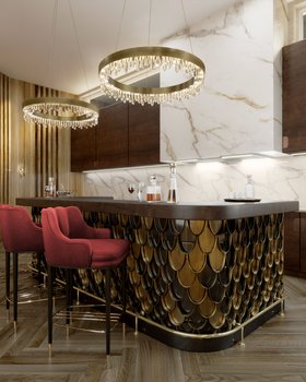 Kitchen | brown wood and white marble kitchen island in gold details with Plum deep red bar chair, Naicca crystal chandelier, and wood flooring