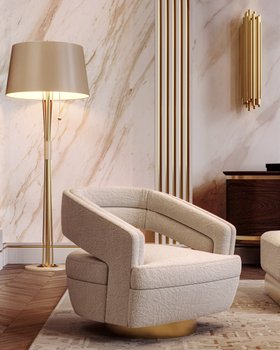 Living Room | autumn/winter reading corner in retro style with Russel curvy white armchair, Miles floor lamp, Brubeck gold wall lamp, marble wall, and wood flooring