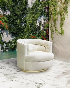 Outdoors | outdoor pool area with Cocktail curvy white armchair, marble flooring, and some greenery