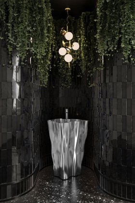 Bathroom | dark paint bathroom with Eden silver freestanding, Hera gold pendant lamp, some greenery, and marble flooring