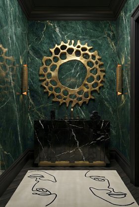 Bathroom | deep green marble bathroom in modern classic style with Nazca dark vanity cabinet for storage, Helios gold wall mirror, Cyrus wall lamp, Taupe black and white rug, and wood flooring