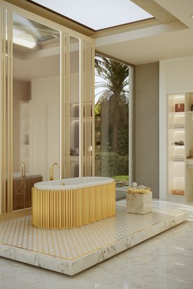 Bathroom | marble bathroom in gold details with Symphony bathtub, Stonehenge side table, wall mirror, shelves for storage, and marble flooring