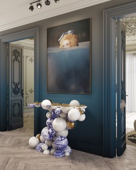 Entryway | deep blue paint hallway in modern classic style with Newton white console in portuguese tile, wall art, and brown wood flooring
