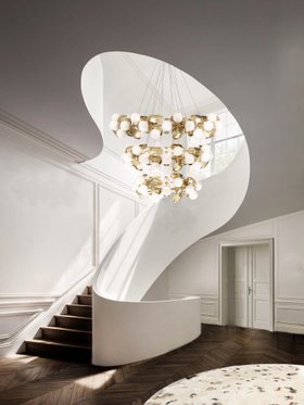Hallway | white paint entryway in art deco style with Hera gold suspension lamp, curvy staircase, and brown wood flooring