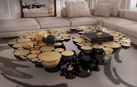 Living Room | cosy elegant reading corner in dark and gold tones with Newton center table, Imperfectio modular sofa, and cushion