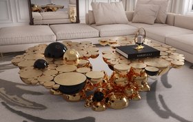 Living Room | luxury reading corner in cosy elegant style with Newton gold and dark center table, Imperfectio modular sofa, and cushion