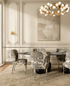 Dining Room | cosy elegant dining area in modern classic style with Dalyan black and white dining chair, Pietra dark marble dining table, Hera gold suspension lamp, White Garden neutral rug, Cubic sconces wall lamp, rococo wall decor, and wood flooring