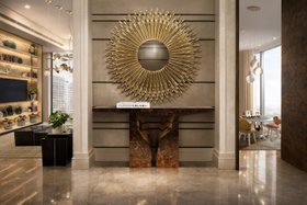 An Upscale Apartment in India | exquisite hallway in modern classic style with Goddess gold wall mirror, Lapiaz walnut wood console, and marble flooring