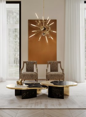 Living Room | autumn/winter reading corner in modern classic style with Cayo curvy bold armchair, Supernova gold chandelier, Ophelia dark marble center table, neutral rug, curtain, and wood flooring