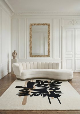 Living Room | autumn/winter reading corner in cosy artful style with Powel II curvy white sofa, Inkahole neutral rug, Cay rectangle wall mirror, sculpture, and brown wood flooring