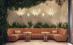 Living Room | spring/summer reading corner in nature-inspired style with Sophia retro orange sofa, Hanna gold coffee table, Turner pendant lamp, some greenery, and marble flooring