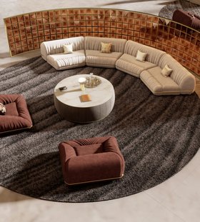 Living Room | cosy neutral reading corner in mid-century modern style with Xenon modular sofa, Xenon terracotta armchair, Florence white marble center table, Mirage table lamp, Kara dark rug, and cushion