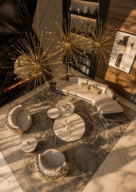 Living Room | mid-century modern reading corner with Cannonball retro suspension lamp, Empire set of center tables, Otto gold armchair, Algerone angular sofa, cosy rug, cushion, and marble flooring