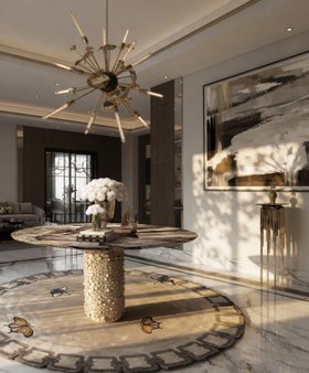 Hallway | luxury modern entryway with Patagon gold round table, Supernova chandelier, Metamorphosis animal print rug, vase, and marble flooring