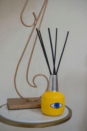 YELLOW "EYE" SCENT DIFFUSER WITH 9 REED STICKS
