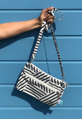 RECYCLED BOTTLES BLACK AND WHITE GRAPHIC PRINT CROSS-BODY BAG