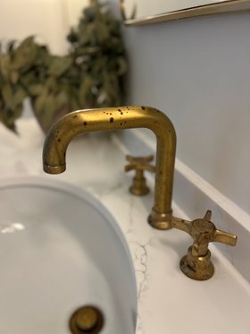 Swadling Illustrious Deck Mounted Basin Mixer with Curved Spout and Brushed Brass finish close up of living finish