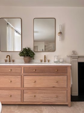 Swadling Illustrious Deck Mounted Basin Mixer with Curved Spout and Brushed Brass finish on twin vanity front view