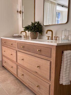 Swadling Illustrious Deck Mounted Basin Mixer with Curved Spout and Brushed Brass finish on twin vanity angle