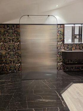 EauZone Dome Framed Wet Room Panel with Aged Brass finish and fluted glass