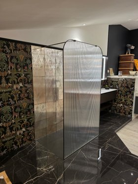 EauZone Dome Framed Wet Room Panel with Aged Brass finish and fluted glass side angle