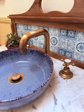 Swadling Brassware Invincible Deck Mounted Basin Mixer with Living Brass finish, Curved Spout and Crosshead Taps with patina development 1