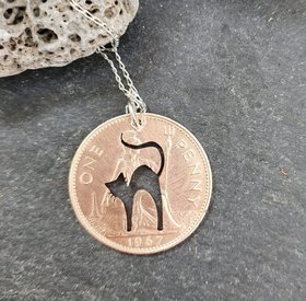 Cat pendant handpierced from penny coin