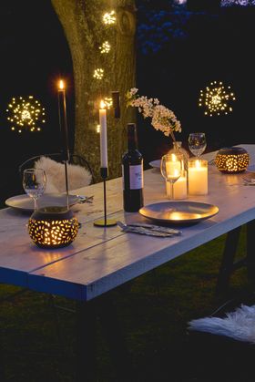 Solar flame lantern on a outdoor table